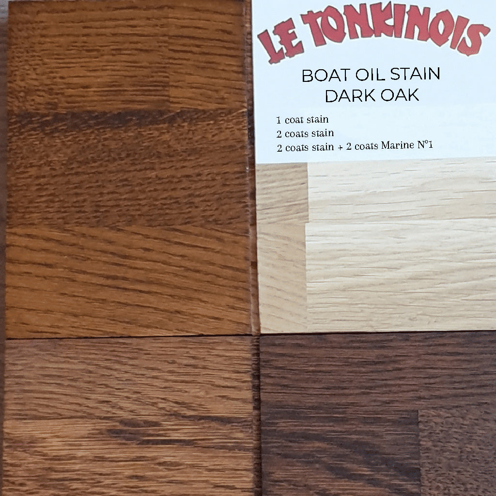 Close-up of a drawdown sample on a wooden surface showing the saturation of different coats of Le Tonkinois Boat Oil Stain in Dark Oak.