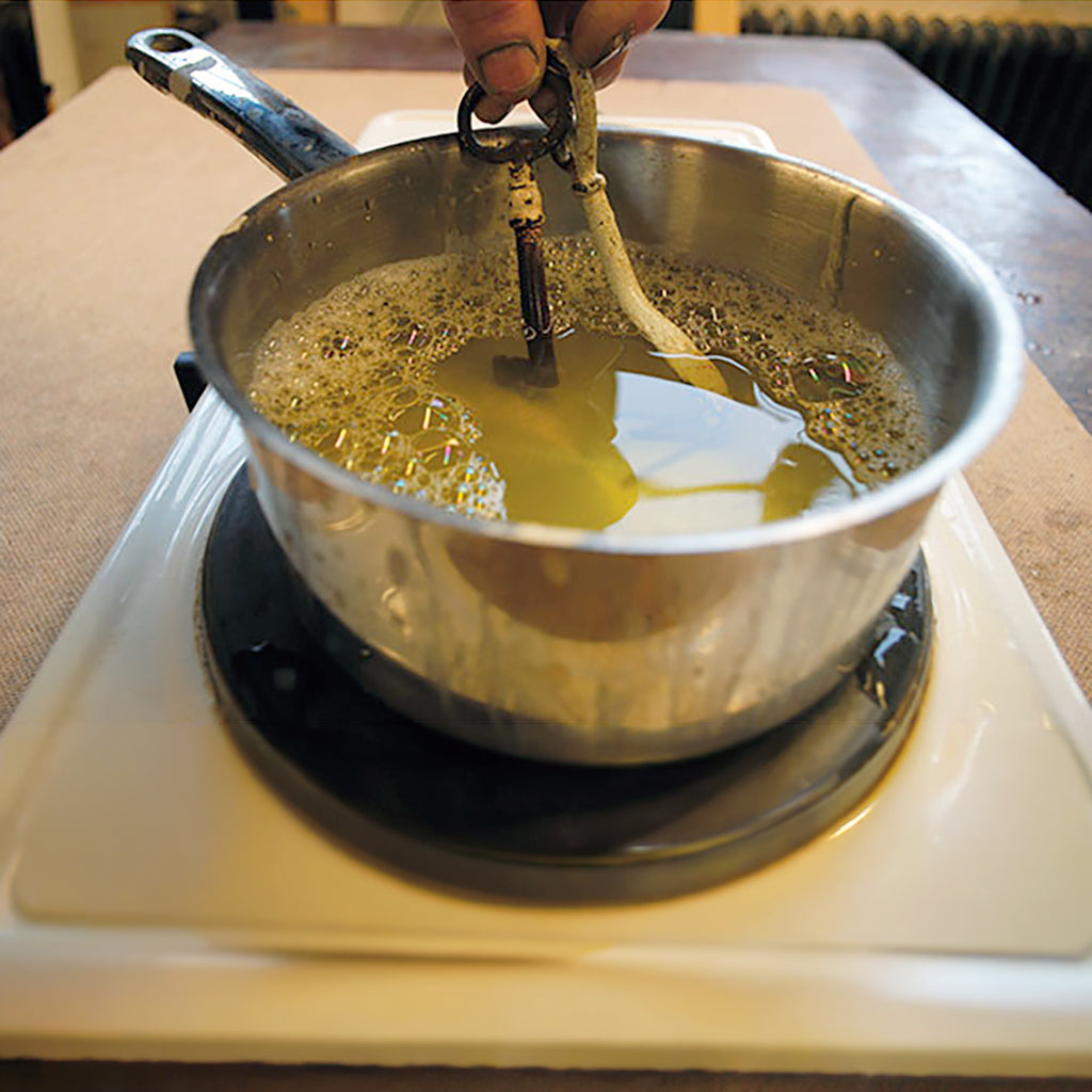 Use Allbäck Linseed Soap for cleaning metal fittings and hardware. Boil rusty or old painted fittings and hardware in 50/50 Linseed Oil Soap and water for a few hours. Leave to cool overnight. Remove the fittings, and brush them off in clean water, and leave to dry. Be sure to capture old paint sludge and dispose safely. The oily residue from the soap will leave the metal with a nice patina and well protected.