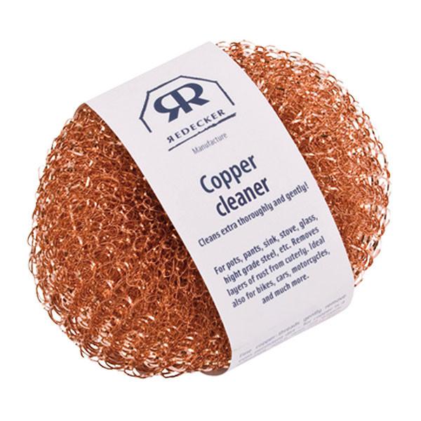 Two Copper Scouring Pads with a white paper product label wrapped around them.