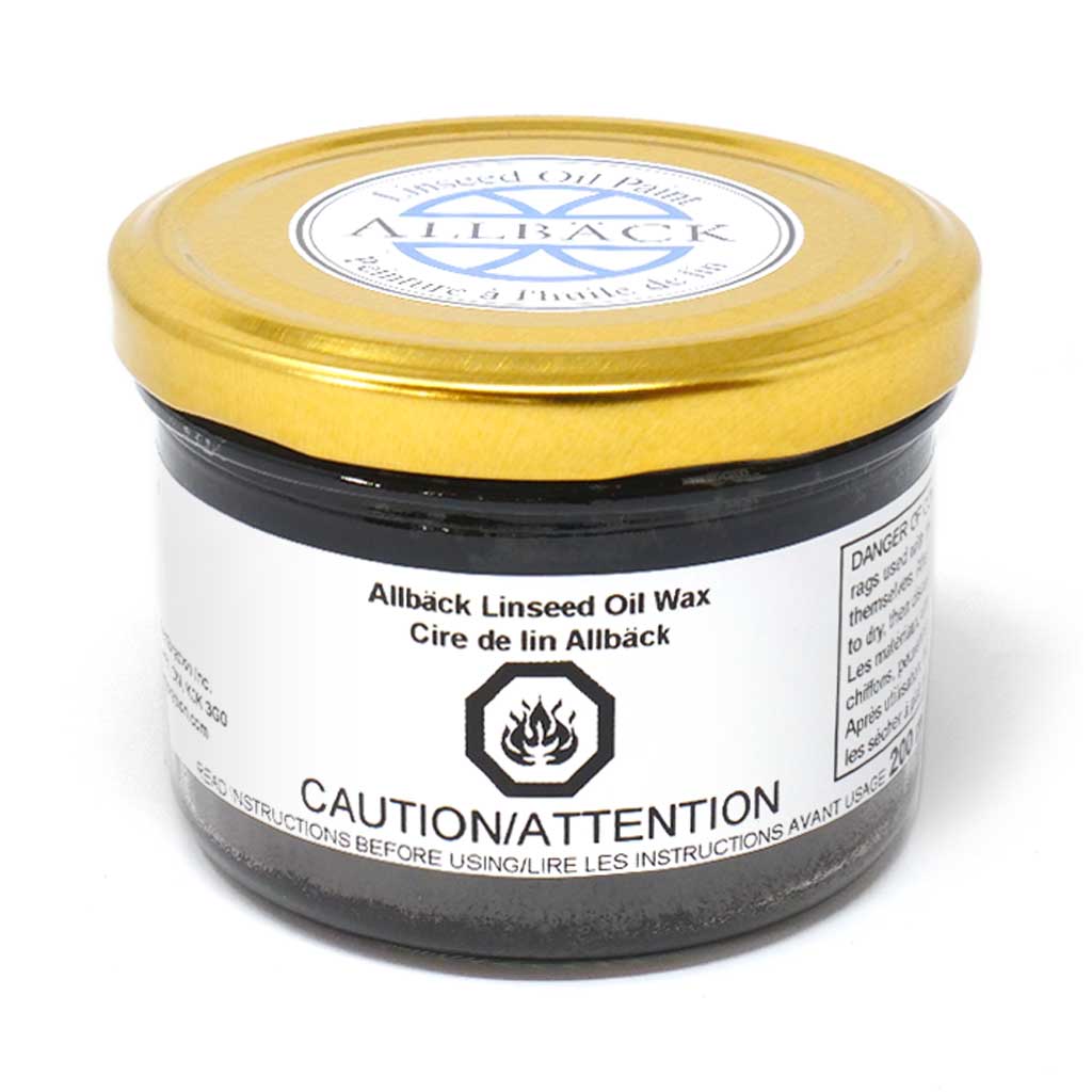 A jar of Black Linseed Oil Wax with a gold lid. 