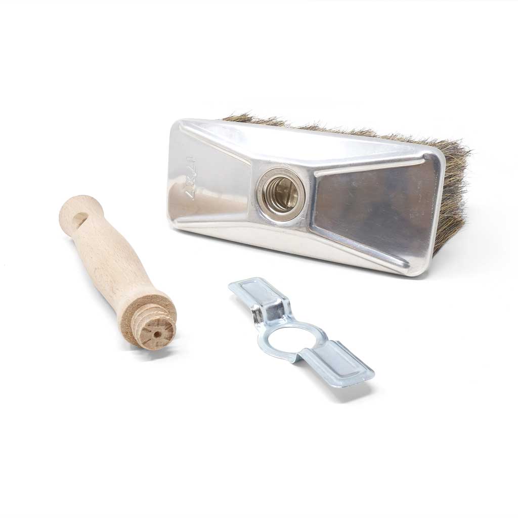 Disassembled large brush with wooden handle.