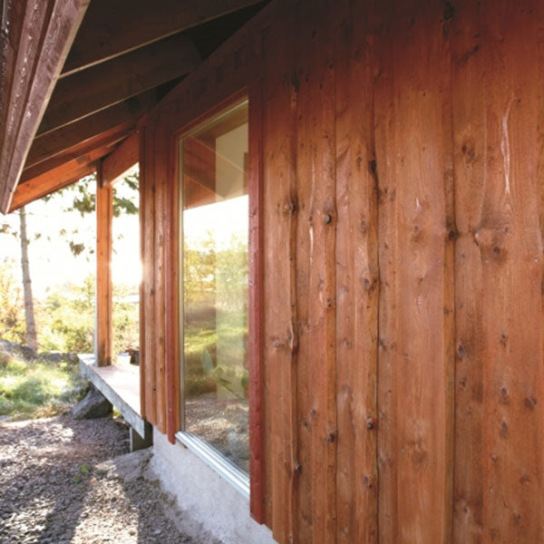 Special Kiln Burned Pine Tar on reverse board and batten siding.