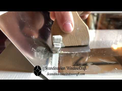 Video of Scandinavian WindowCraft Ergo Glass Scraper and Swedish Spackling Blade being used to to trim linseed oil paint lines from glass during window restoration.