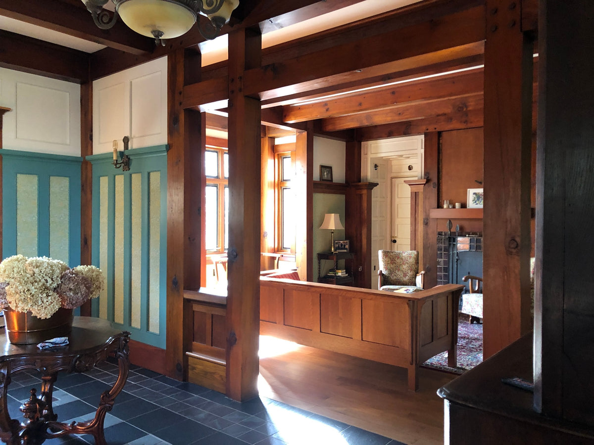 Interior with exposed posts and beams and built-in woodwork