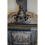 Section of cast iron wood stove rejuvenated with Allbäck Linseed Oil Stove Blacking Fireplace Paint.