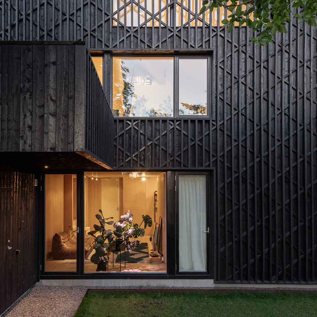 Black-Brown Pine Tar on this modern house a good alternative to Shou Sugi Ban technique.