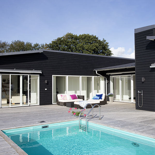 Black Pine Tar on modern oceanside house, Sweden.