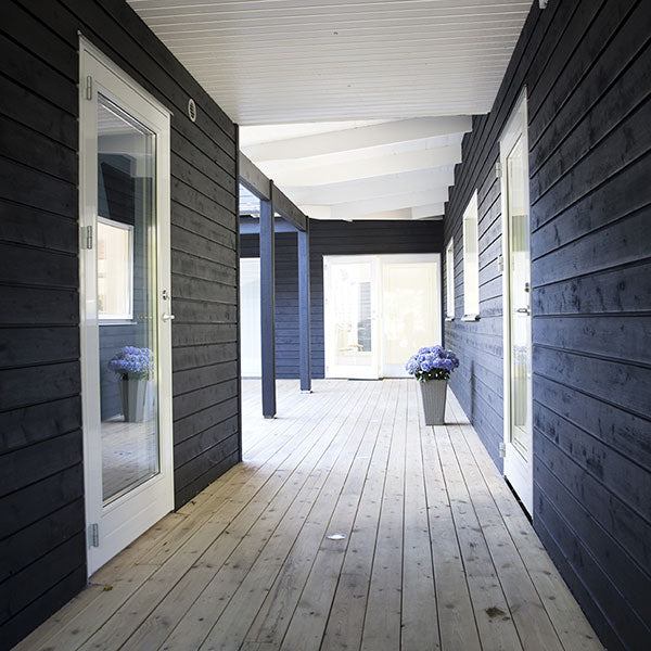 Black Pine Tar on modern oceanside house, Sweden.