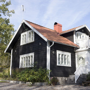 Black Pine Tar on old log house, Sweden.