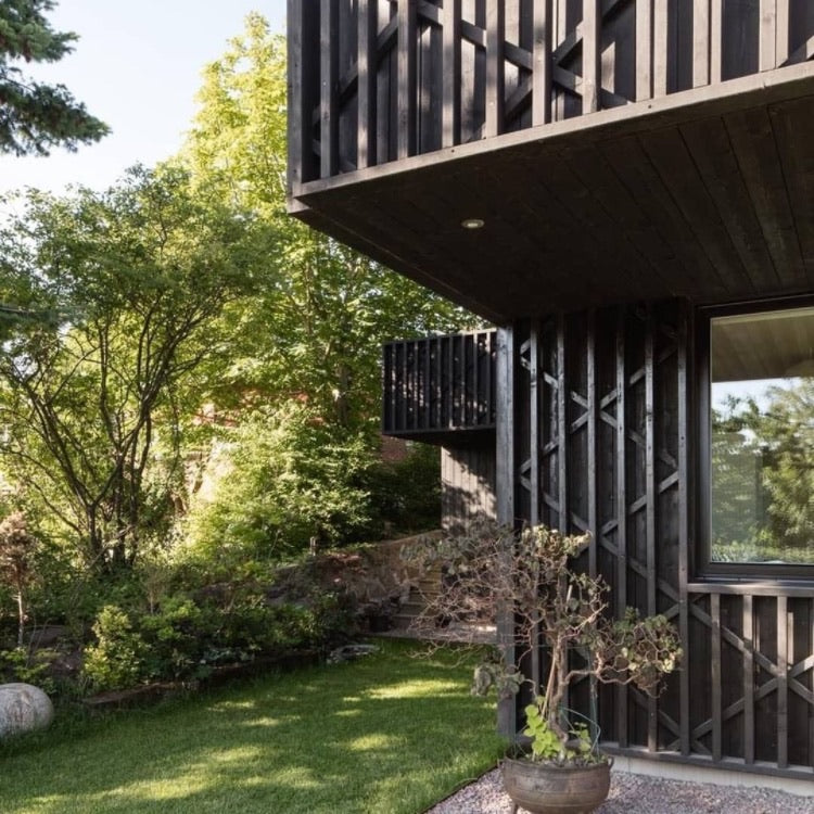 Black-Brown Pine Tar on this modern house a good alternative to Shou Sugi Ban technique.